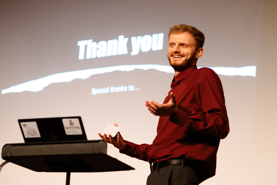 Student giving a presentation using a laptop.