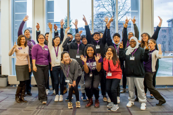 The International Services team and international students pose together on the WSU campus.