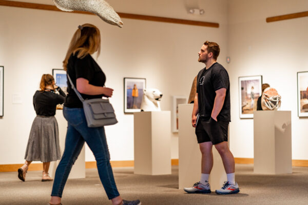 People walk through an exhibit at the Minnesota Marine Art Museum in Winona.