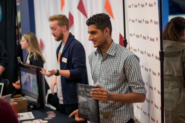 Students explain their campaign concepts during the Campaign Tradeshow event on WSU campus.