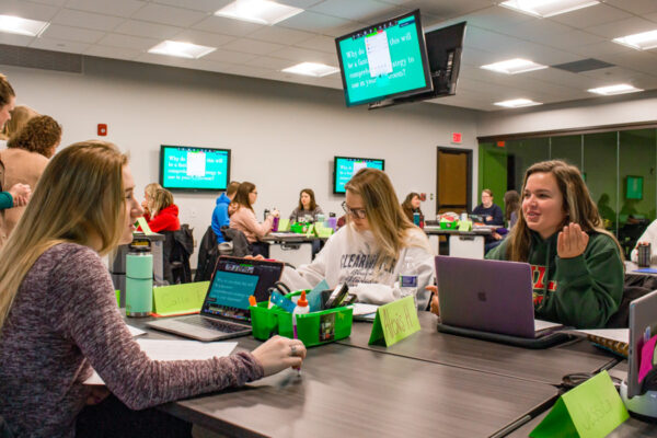 Students work together in a classroom at Helble Hall.