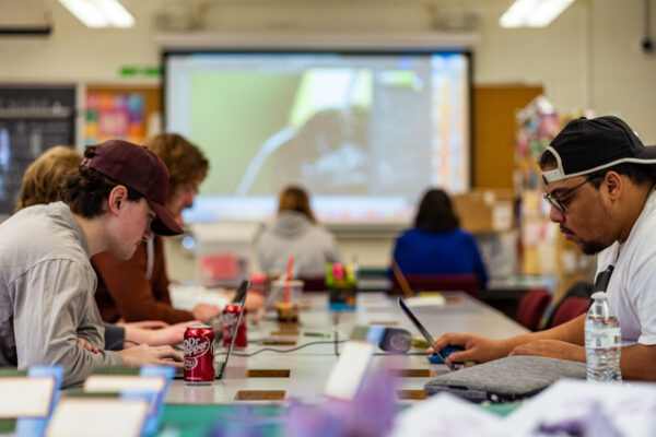 Students work on their laptops during class.