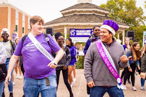 Students dance in front of the gazebo during the Homecoming Pep Fest.